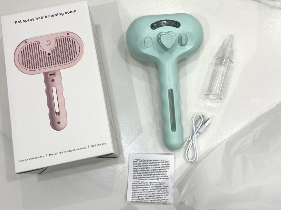 Steam grooming brush with spray bottle and USB charging cable in retail packaging