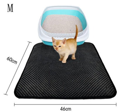 Kitten on a Waggington litter trapping mat in front of a litter box