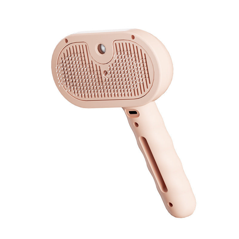 Pink 3-in-1 steam grooming brush on a white background