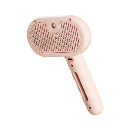 Pink 3-in-1 steam grooming brush on a white background
