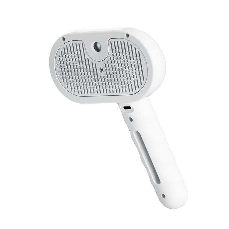 White 3-in-1 steam grooming brush on a white background