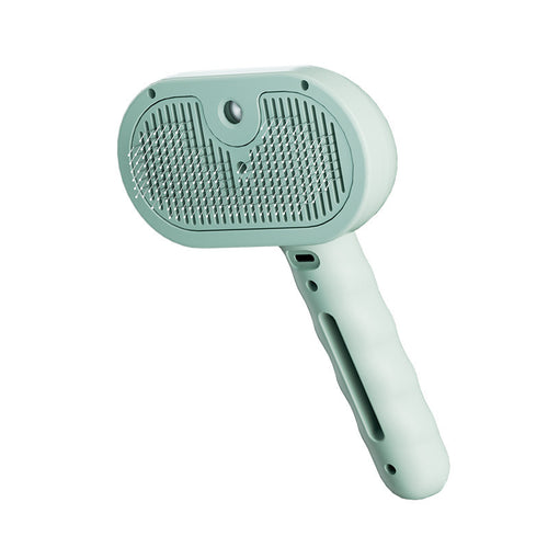 Green 3-in-1 steam grooming brush on a white background
